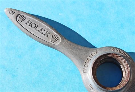 Rolex watch opener tool